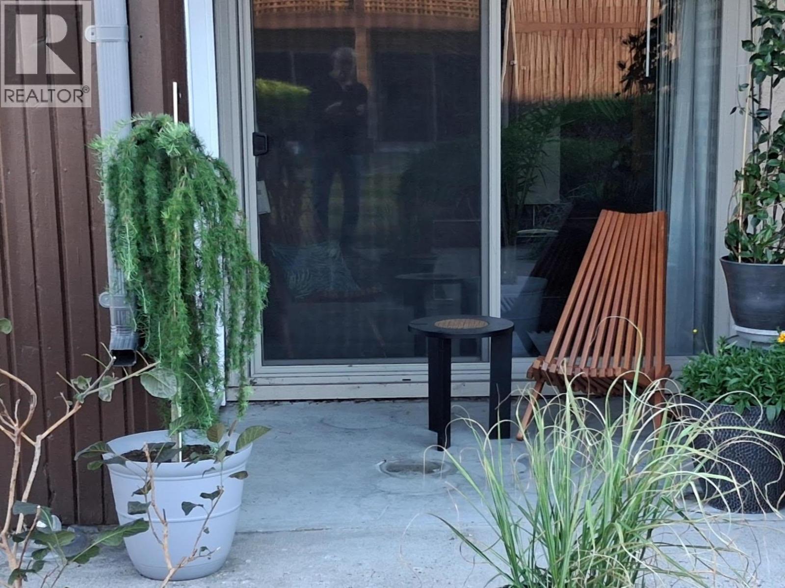 Unit 216 at Tiffany Gardens, 3140 Wilson Street, Penticton — private ground-level patio