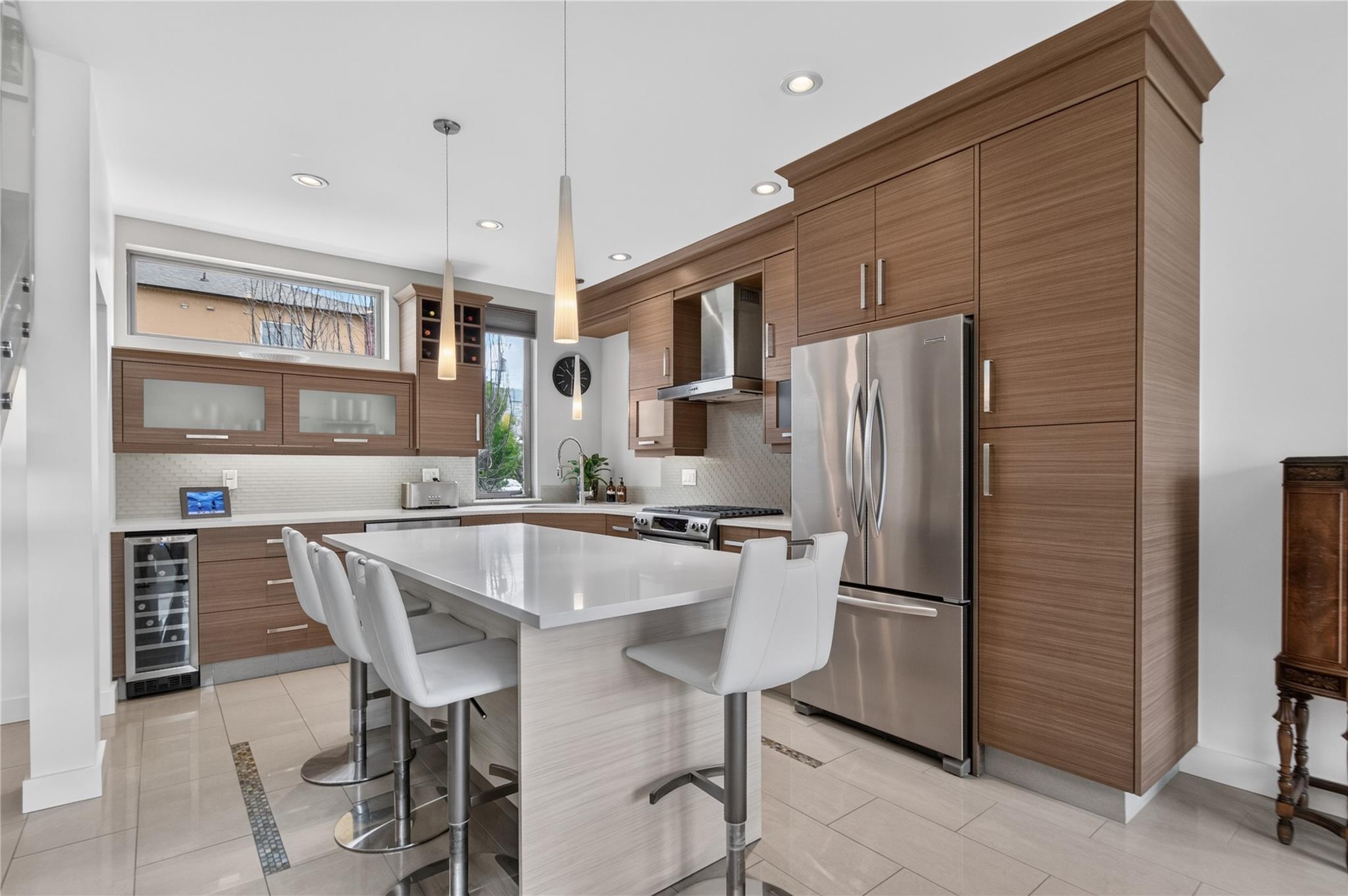 102-433 Churchill Avenue, Penticton — bright modern kitchen with large island and wood cabinetry