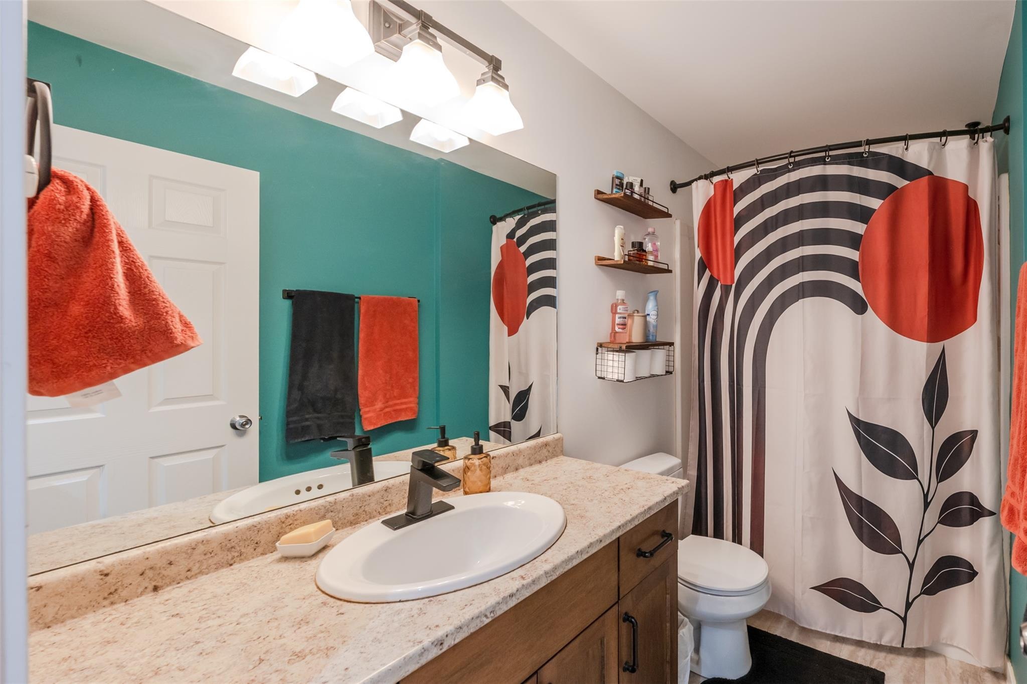 Upper-level four-piece bathroom in Unit 102.