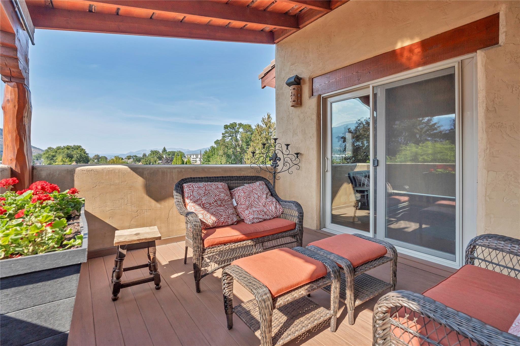 Covered upper terrace with mountain outlook at Unit 105.