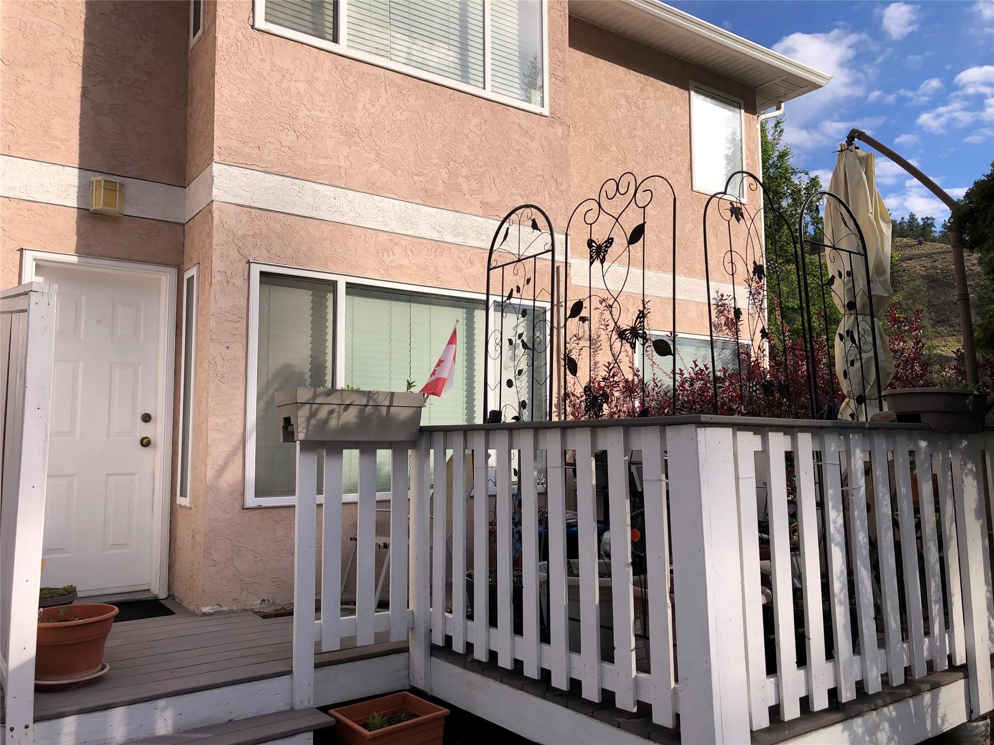 Private deck and rear entry at Unit 119 in Cascade Gardens.