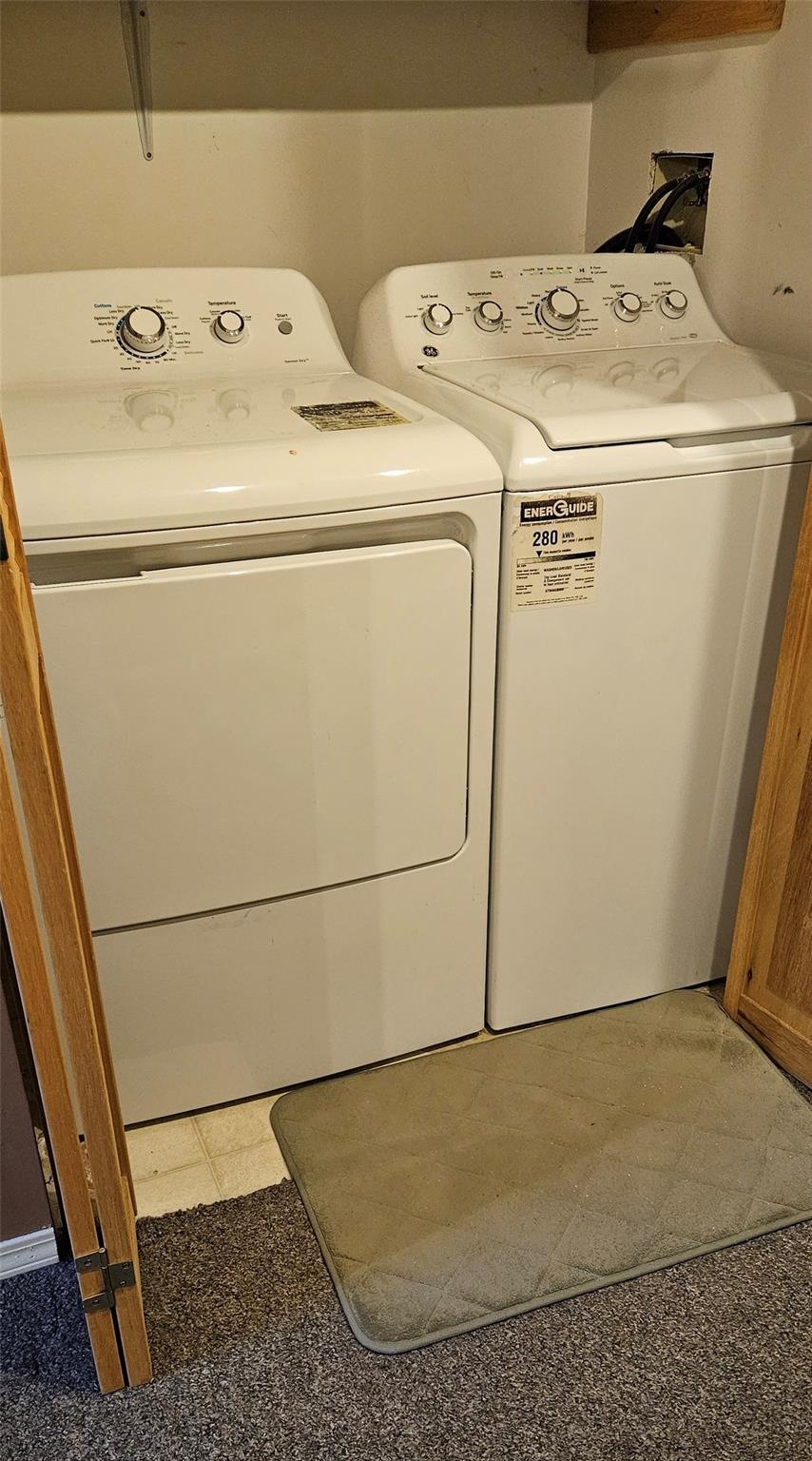Laundry area with washer and dryer at Unit 119.
