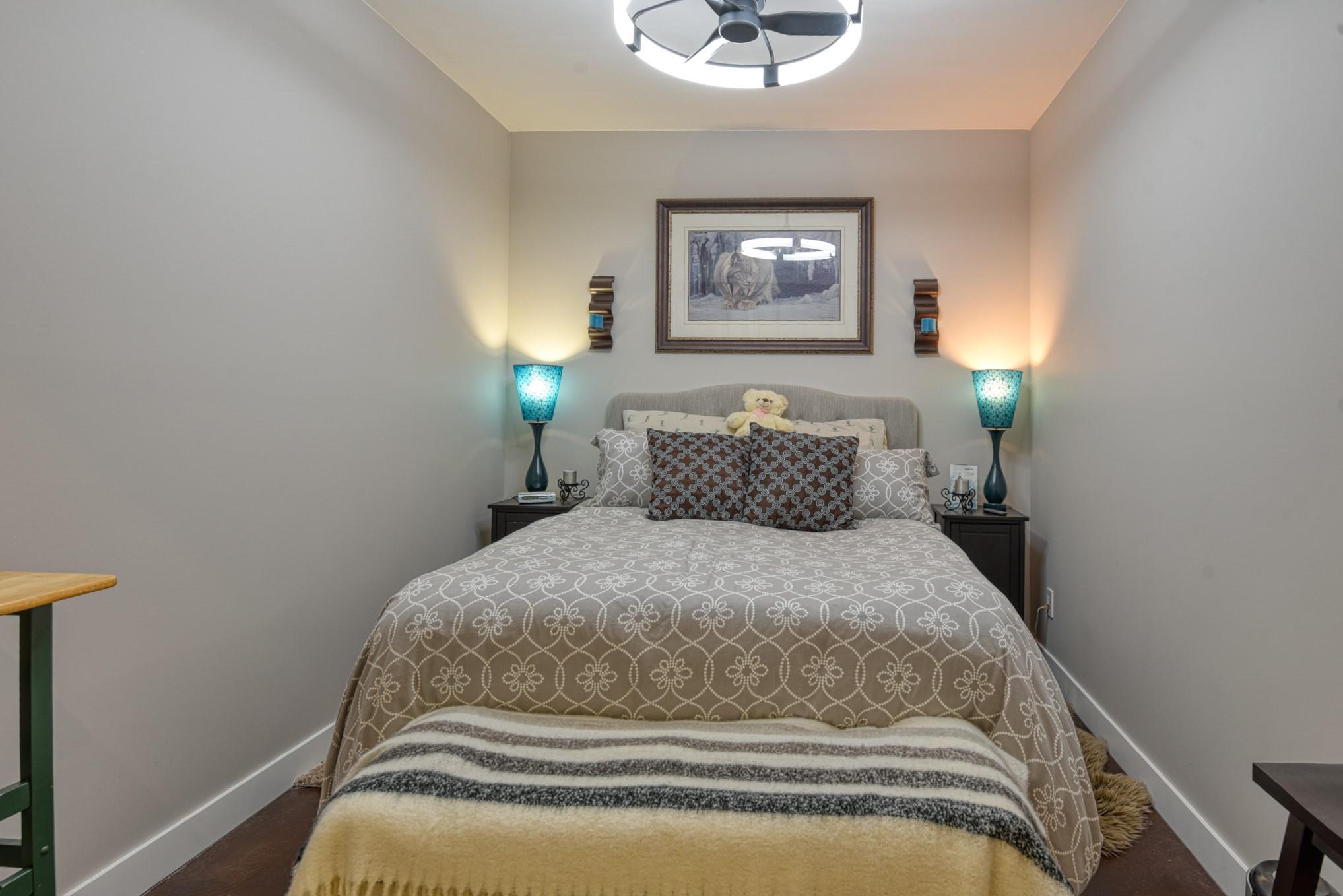 Bedroom with recessed lighting and neutral finishes at Unit 12 in Snowridge.