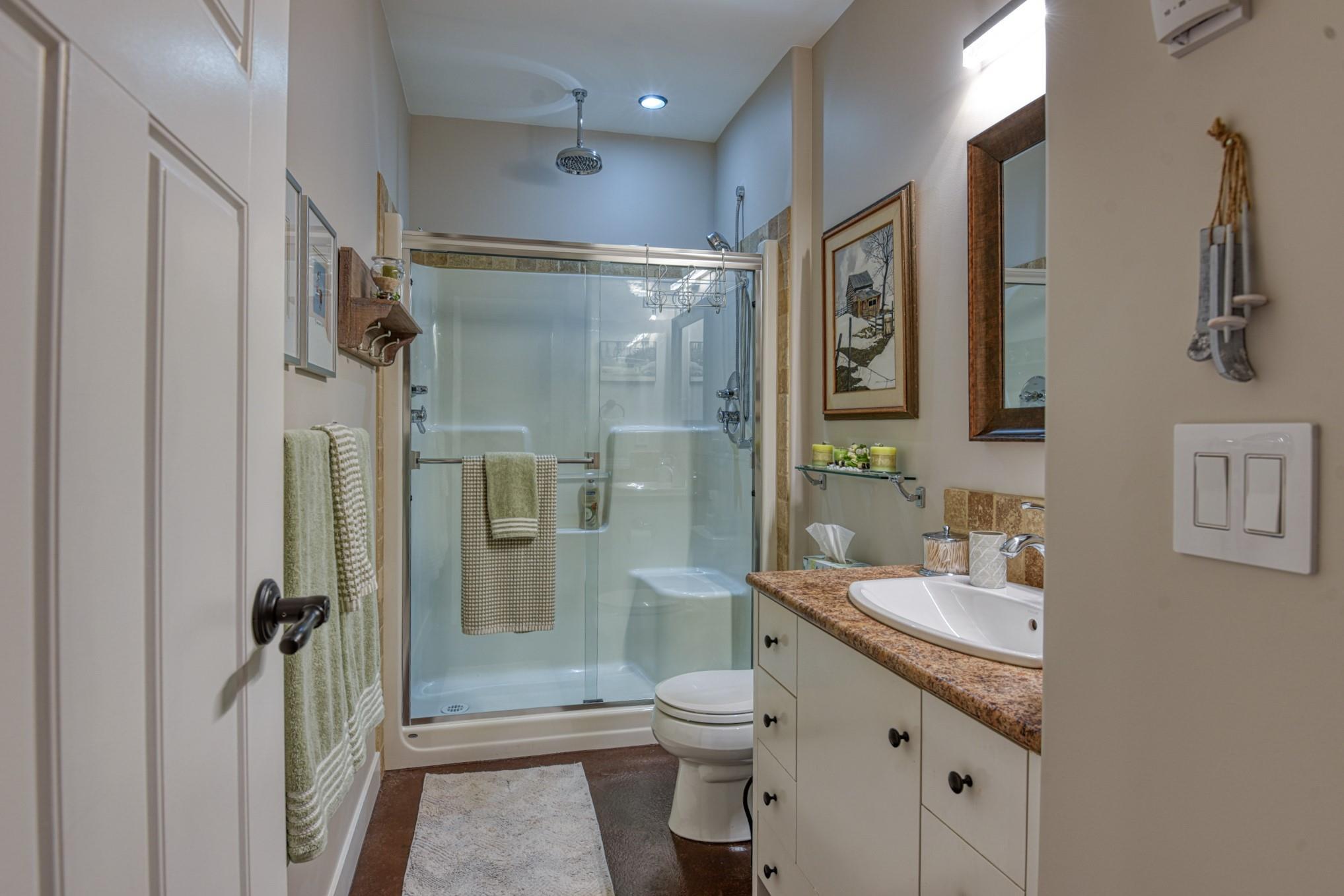 Bathroom with glass shower and vanity at Unit 12 in Snowridge.