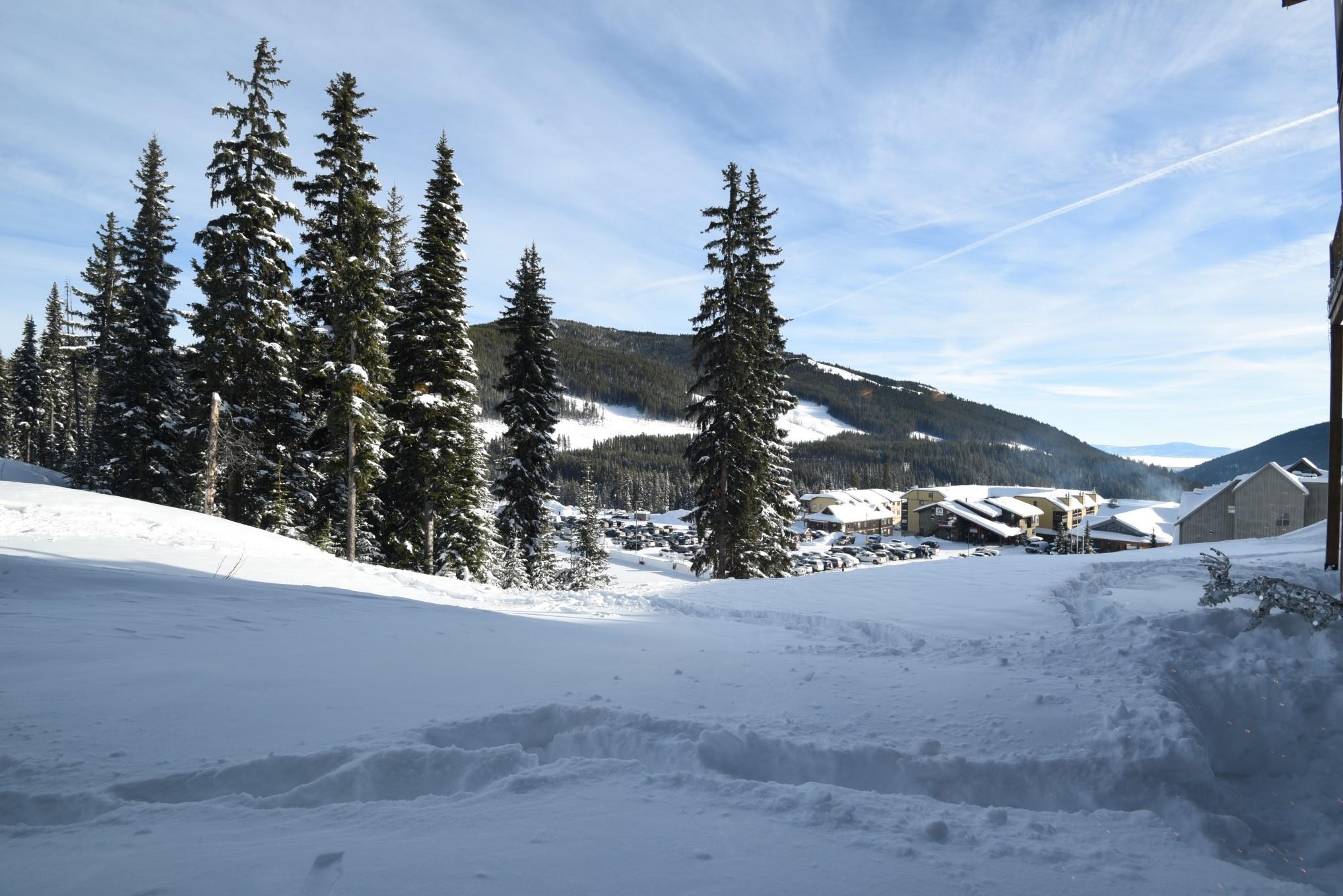Snow-covered mountain and village view near Snowridge at Apex Mountain.