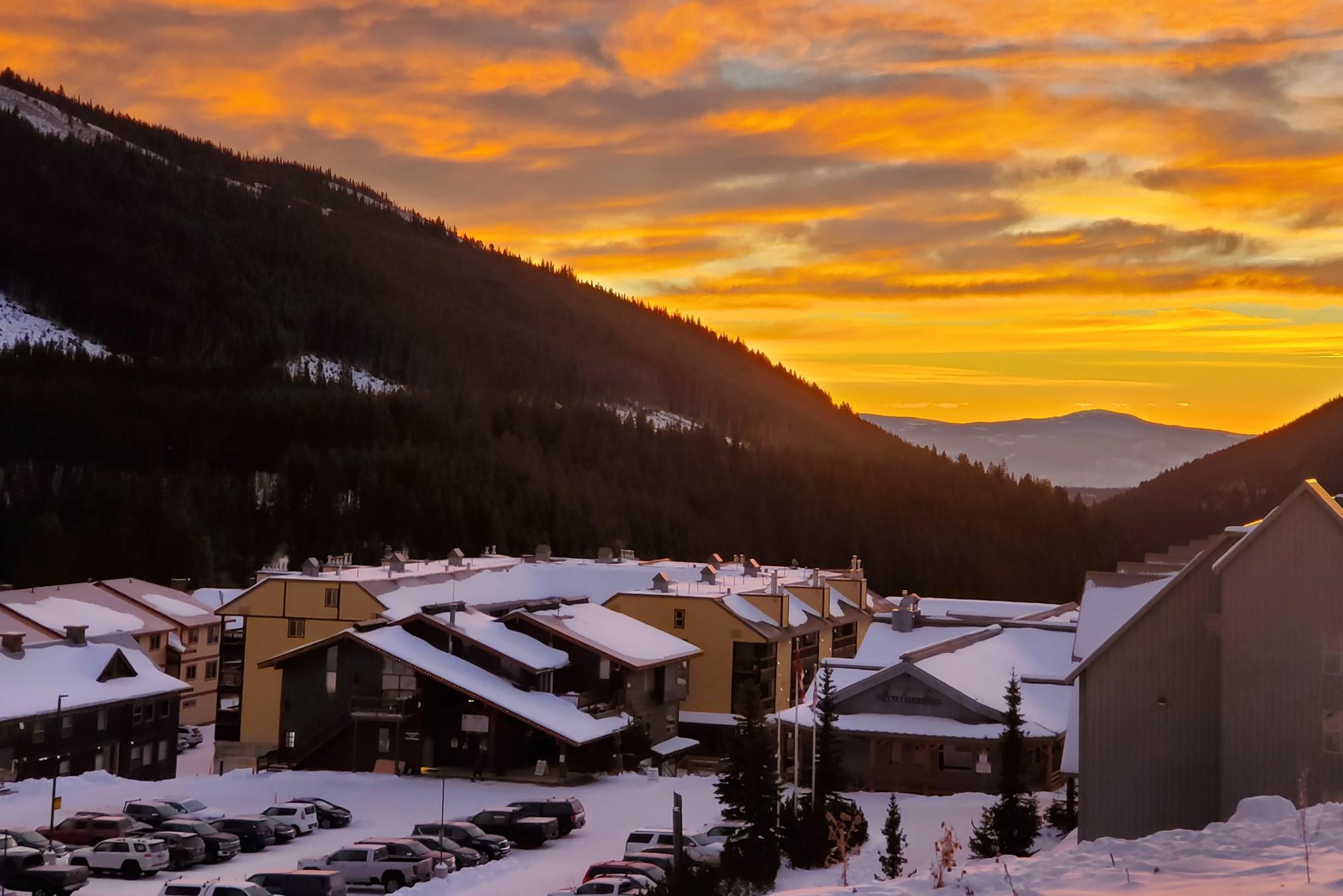 Sunset winter view across the Apex Mountain village and surrounding peaks.