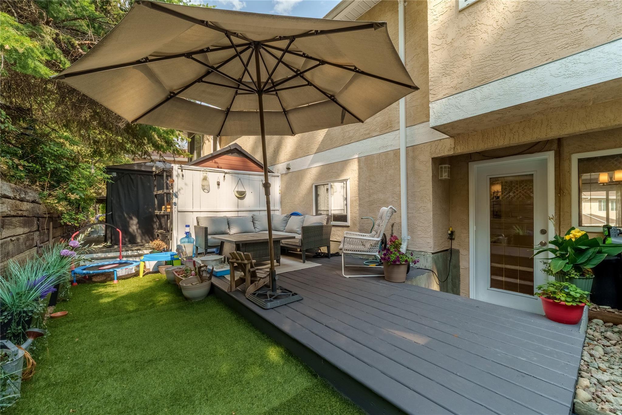 Private fenced patio and low-maintenance backyard at Unit 156.