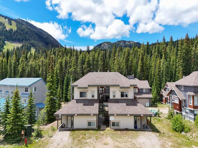 101-156 Clearview Crescent, Apex Mountain — front exterior of The Lofts against the forested mountain setting