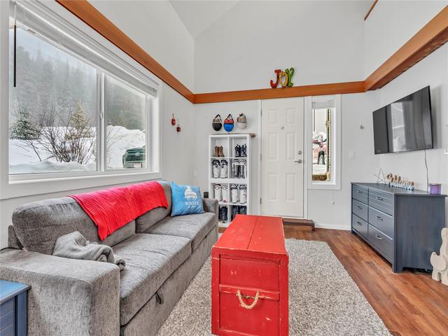 101-156 Clearview Crescent, Apex Mountain — living room with large window and exterior entrance