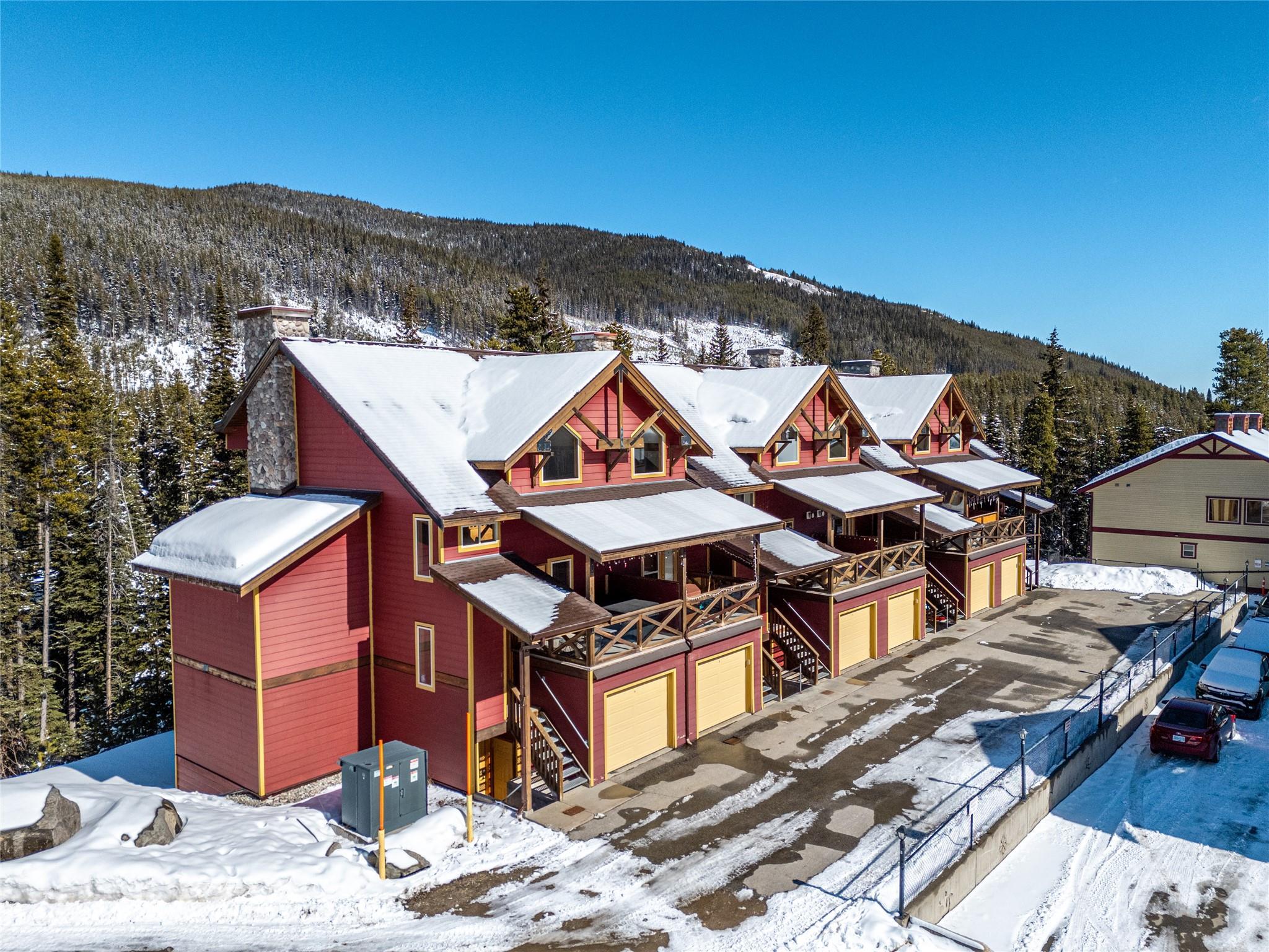 Aerial winter view of Keremeos Creek townhomes at 360 Strayhorse Road, Apex Mountain.