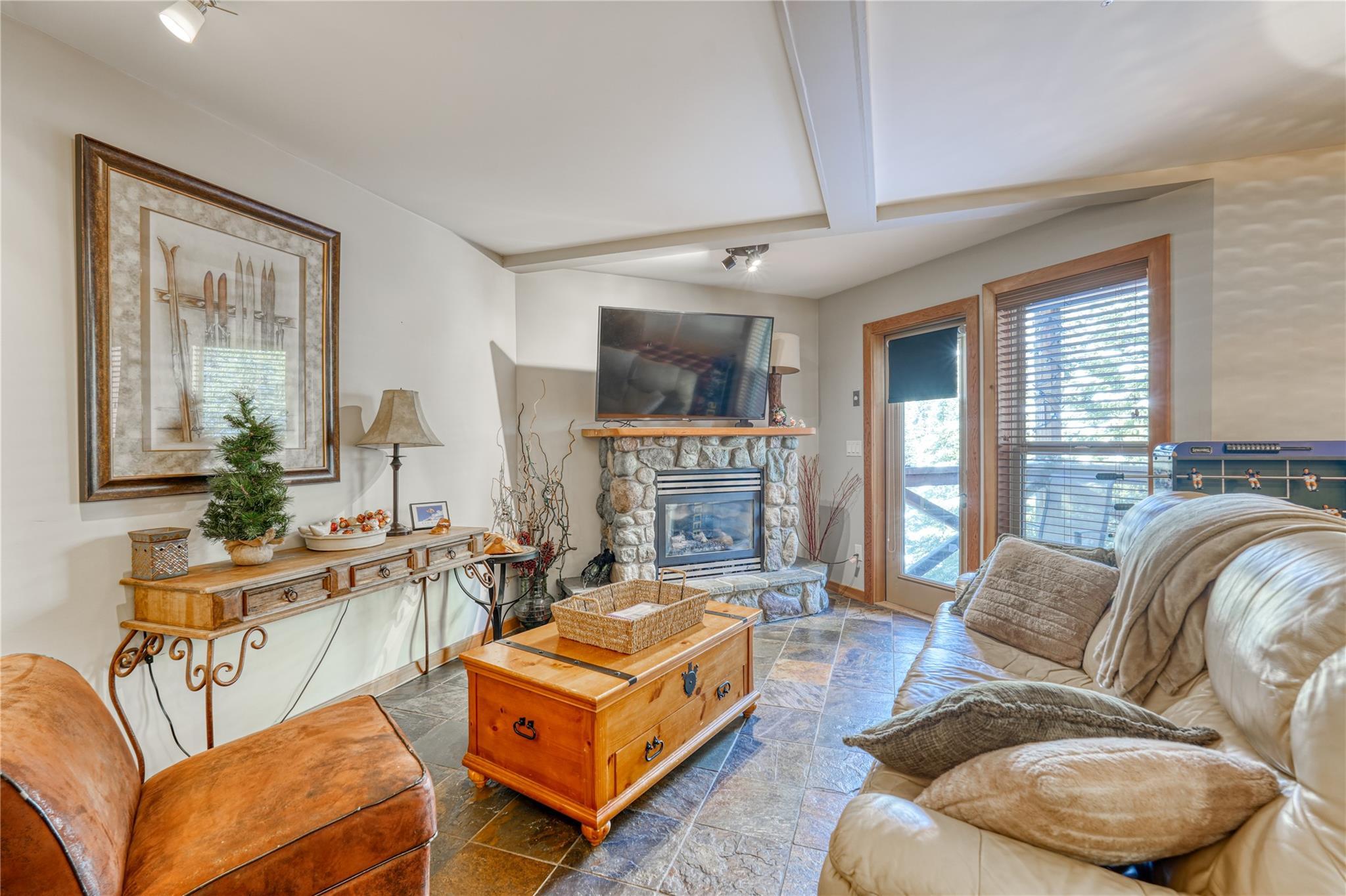 Open living and dining area with large windows in Unit 3 at 360 Strayhorse Road.