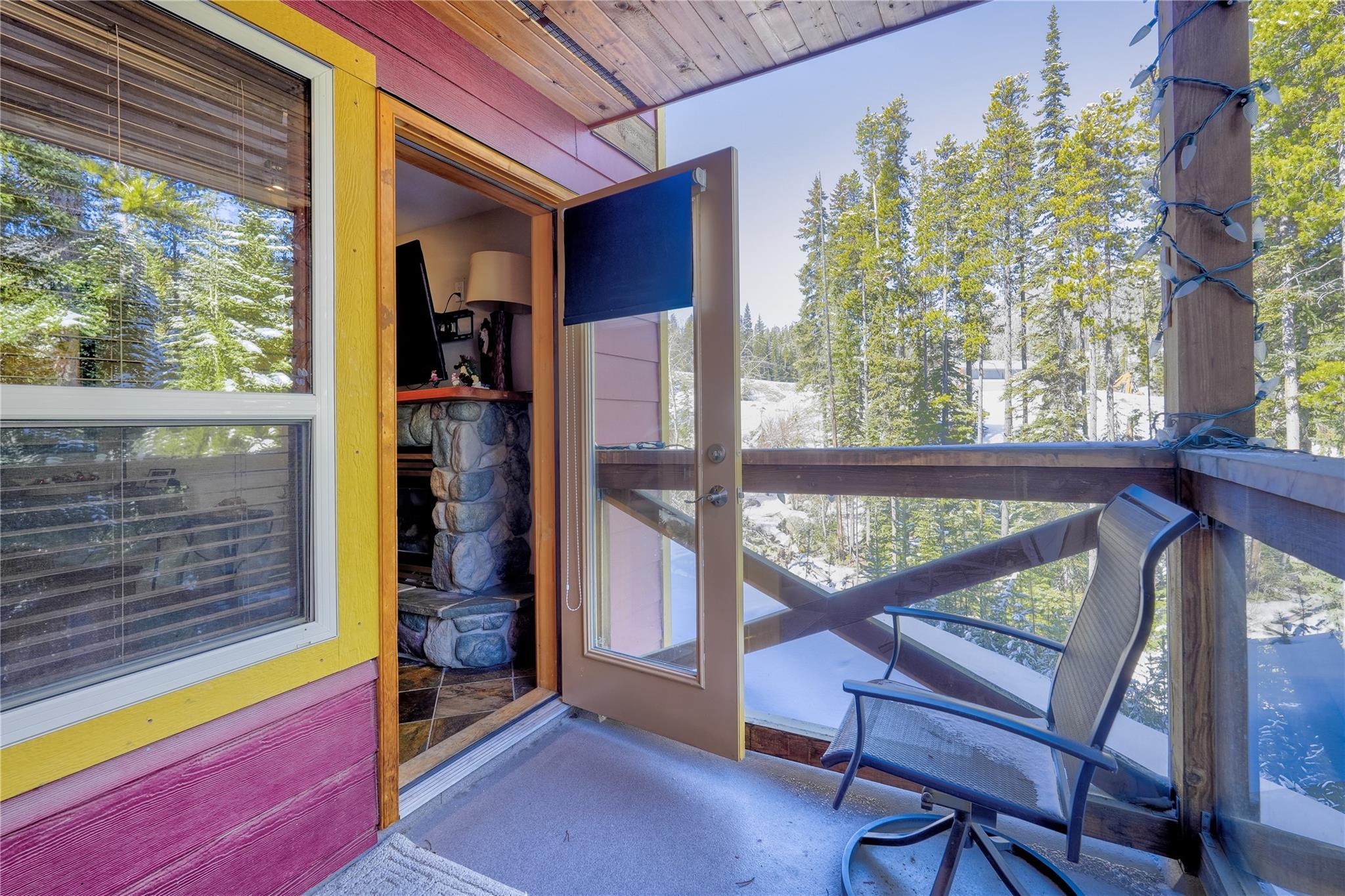 Covered balcony overlooking the creek and forest at Unit 3, 360 Strayhorse Road.