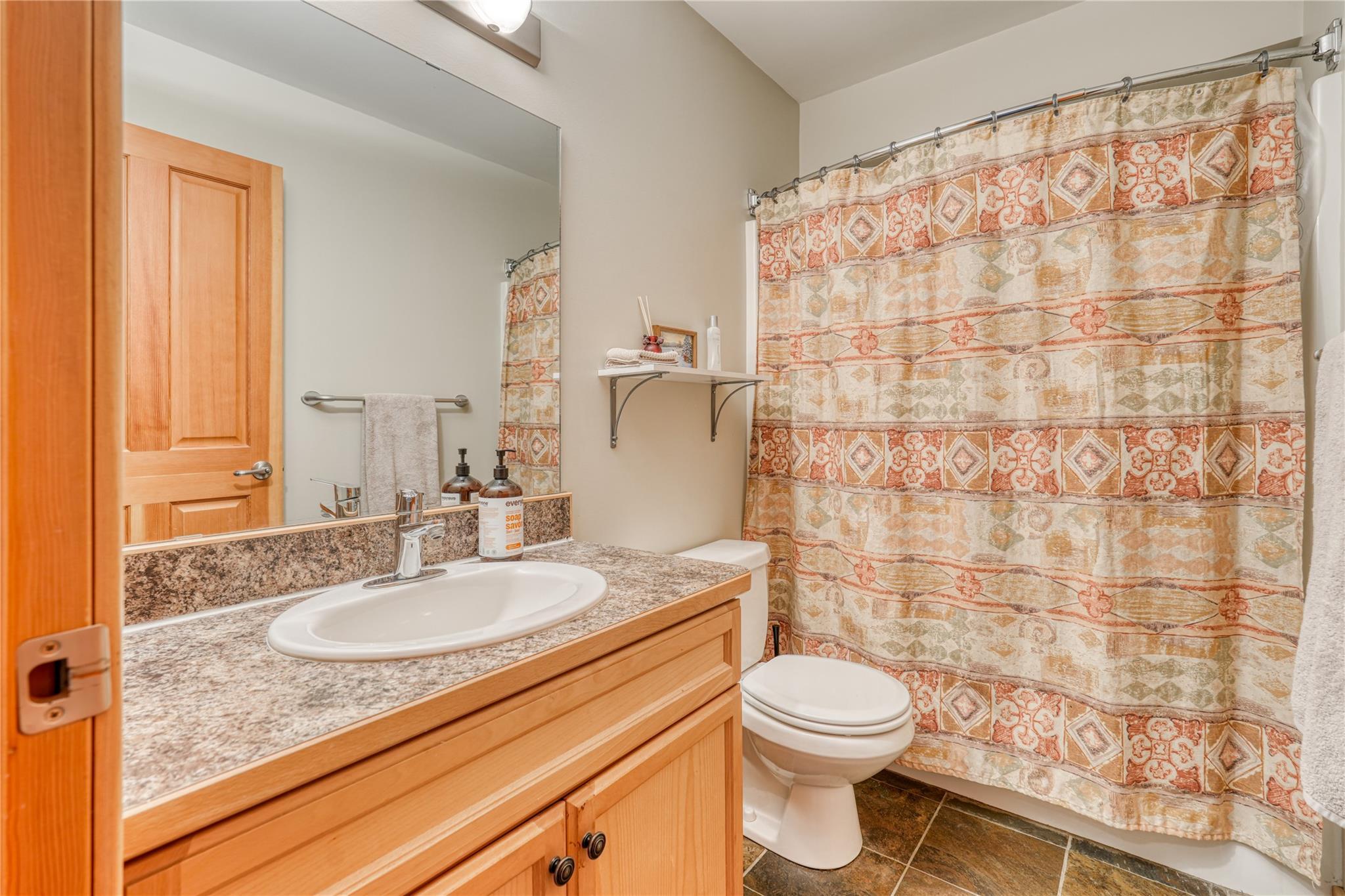 Bathroom with vanity and tub-shower in Unit 3 at 360 Strayhorse Road.