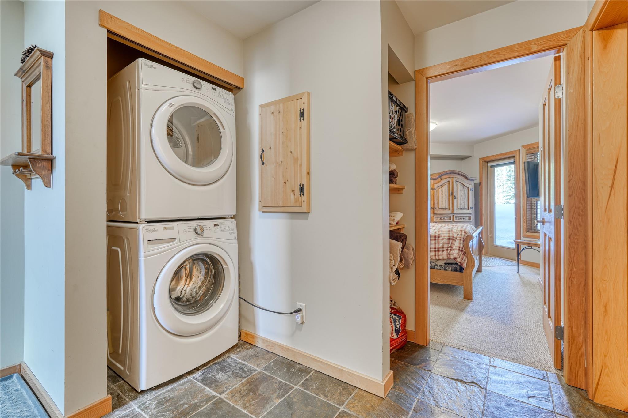 In-suite stacked laundry and hallway in Unit 3 at 360 Strayhorse Road.