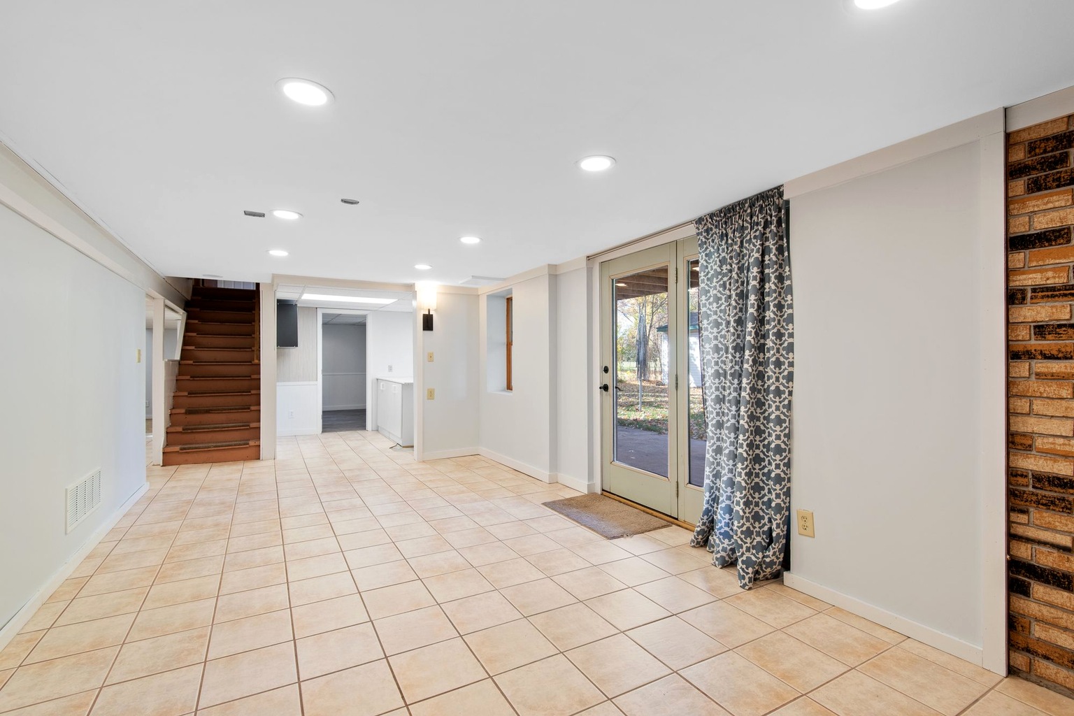 Bright finished basement used as representative editorial imagery for a Penticton townhome basement buyer guide; not a specific property