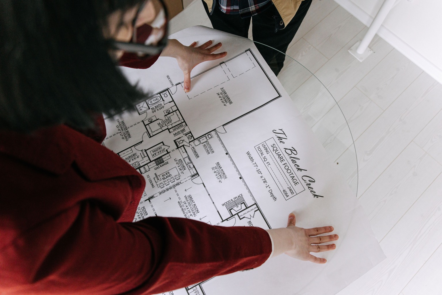 Buyer reviewing architectural plans as part of Penticton townhome due diligence